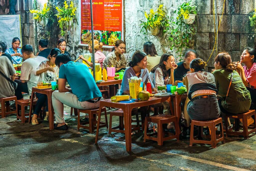 locals eten street food in Hanoi